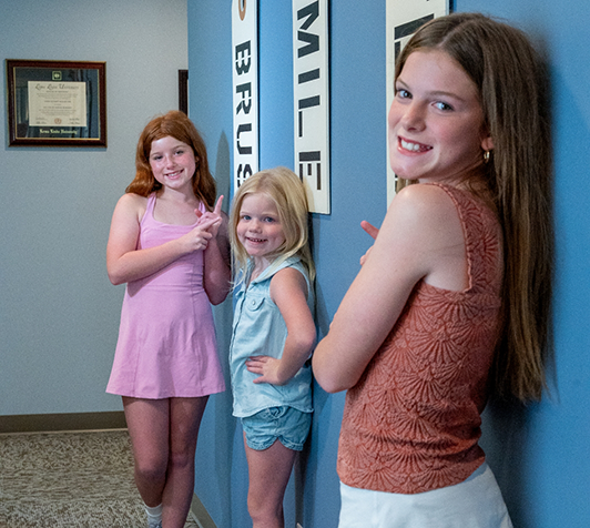 Children in front of wall at dental office