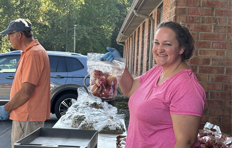 Woman holding a bag of apples