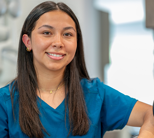 Woman in blue shirt smiling