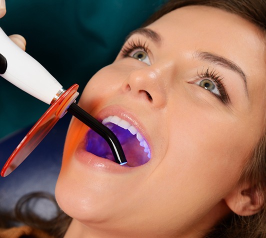Female patient receiving a dental filling