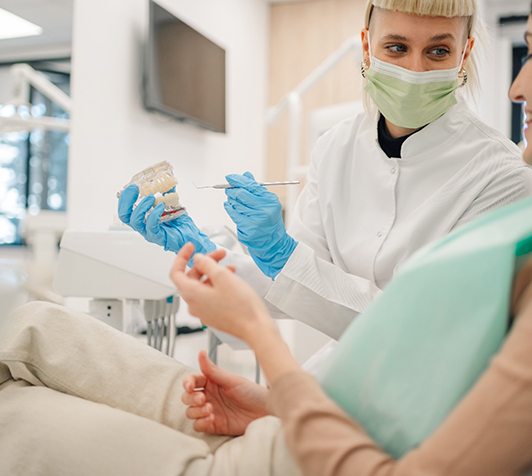 Dentist talking with patient