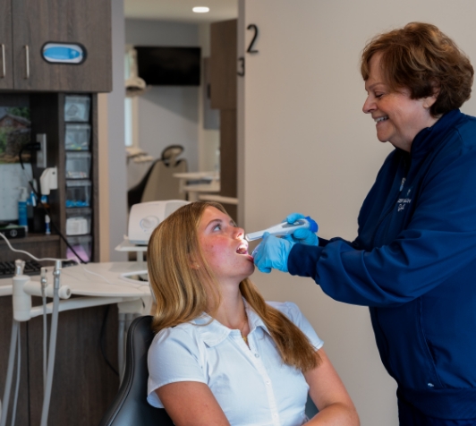 Female patient having teeth examined during dental checkup