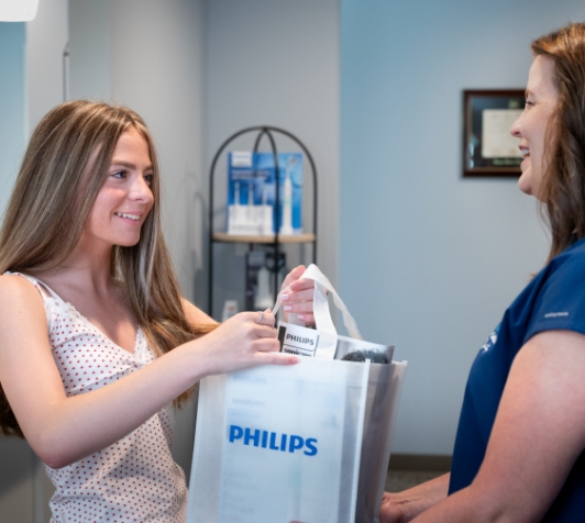Close up of man in dental chair smiling